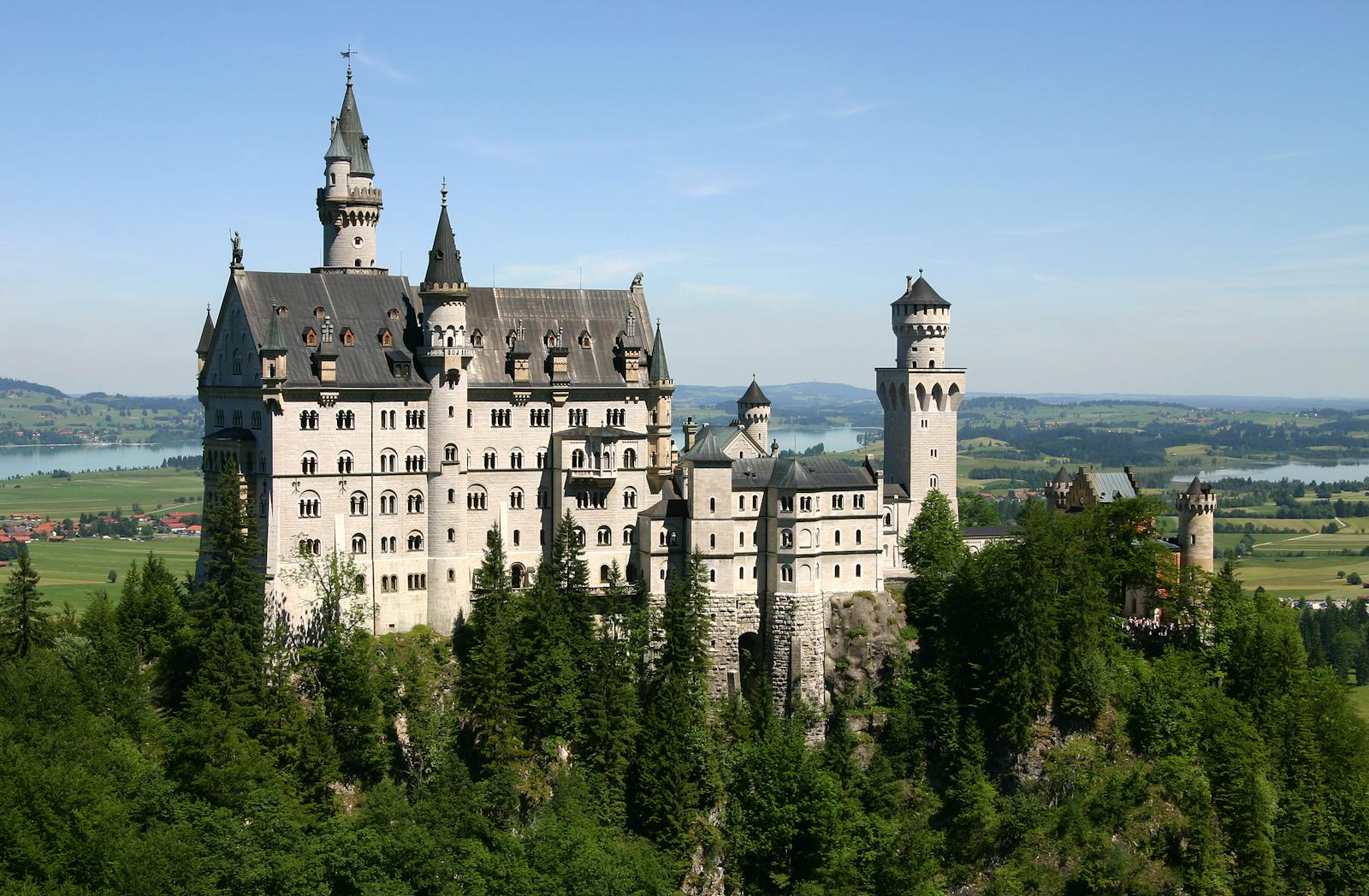 Panoramic view of Neuschwanstein Castle on its hill